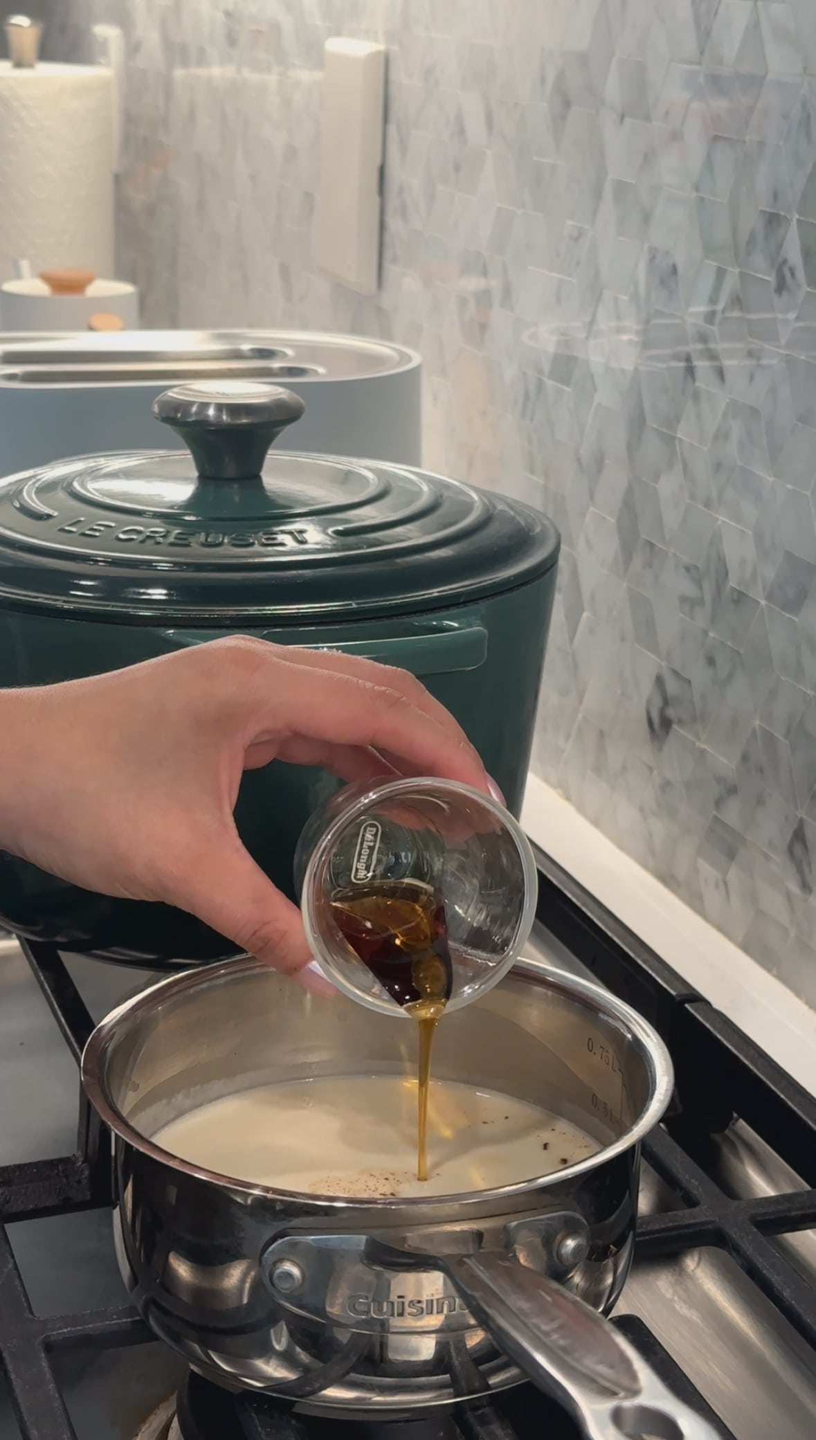 Maple syrup being served in small pot on the stove