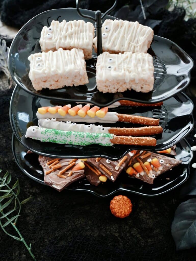3 tier Halloween skull board filled with Halloween desserts